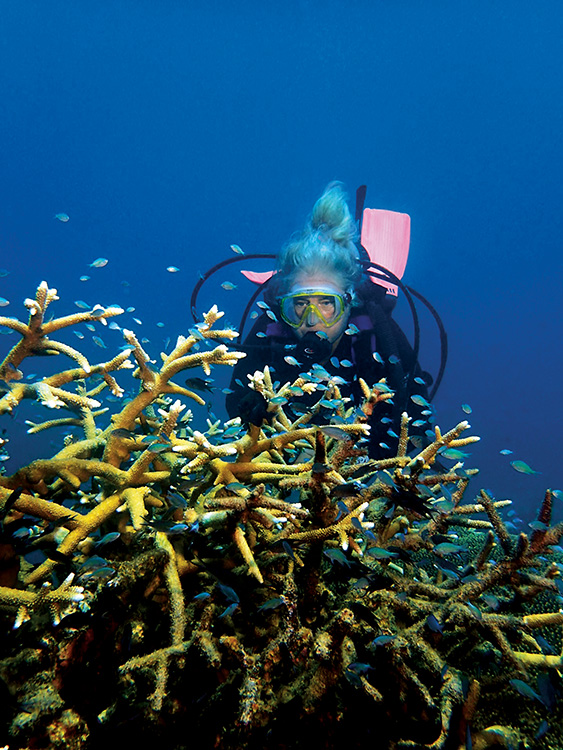 Susan Copelas scuba diving near coral reef