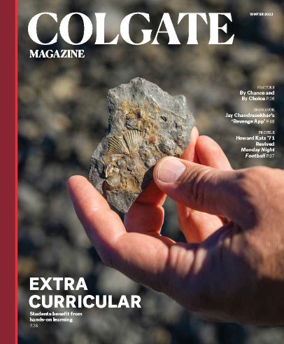 Winter 2023 Cover - a student's hand holding a shell fossil