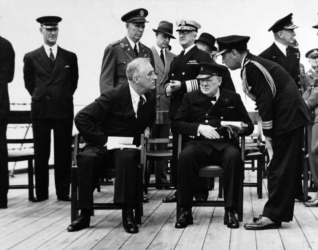 Group photograph including President Franklin D. Roosevelt and Prime Minister Winston S. Churchill on deck of HMS Prince of Wales during the Atlantic Charter. 