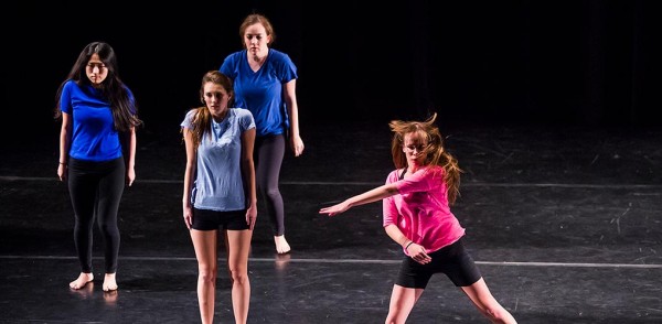 Students dancing on stage at Colgate University