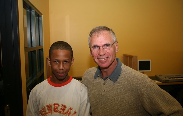 Gary Eichhorn posing with a Music and Youth Student