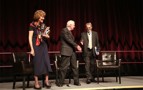 Steven Kepnes shaking hands with President Jimmy Carter on stage