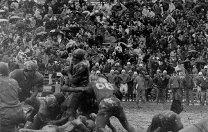 Marv Hubbard carrying the ball in a mud bowl