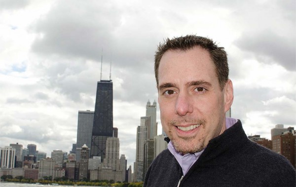 Jeffrey Sumber '92 with Chicago's skyline behind him