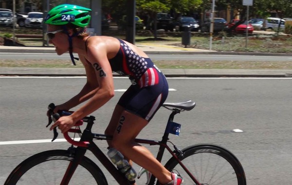 Chelsea Burns '12 on bicycle at Pan Am games.