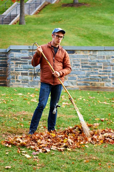 Chris Kallmyer raking on campus