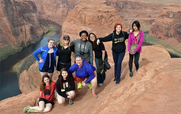Kelda Olson Hutson (front, far right) took her daughter (on her right) and other high schoolers hiking. They’re pictured above the Colorado River in Arizona.