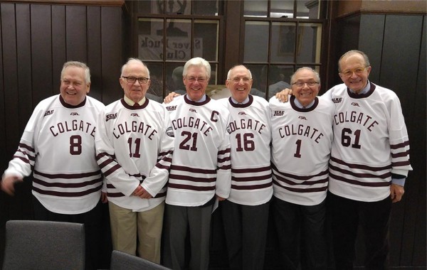 Members of the 1959 hockey team reunited in jerseys
