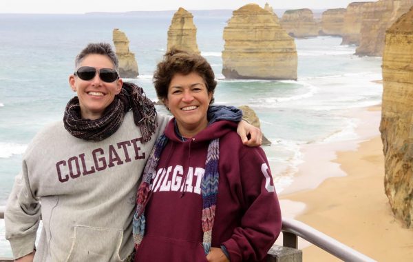Alex Gonzalez ’89 with Barb West ’89 in Colgate sweatshirts on the coast in Melbourne, Australia