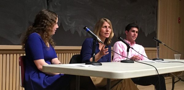 Journalist Sacha Pfeiffer speaking, flanked by the student editors-in-chief of the Maroon-News