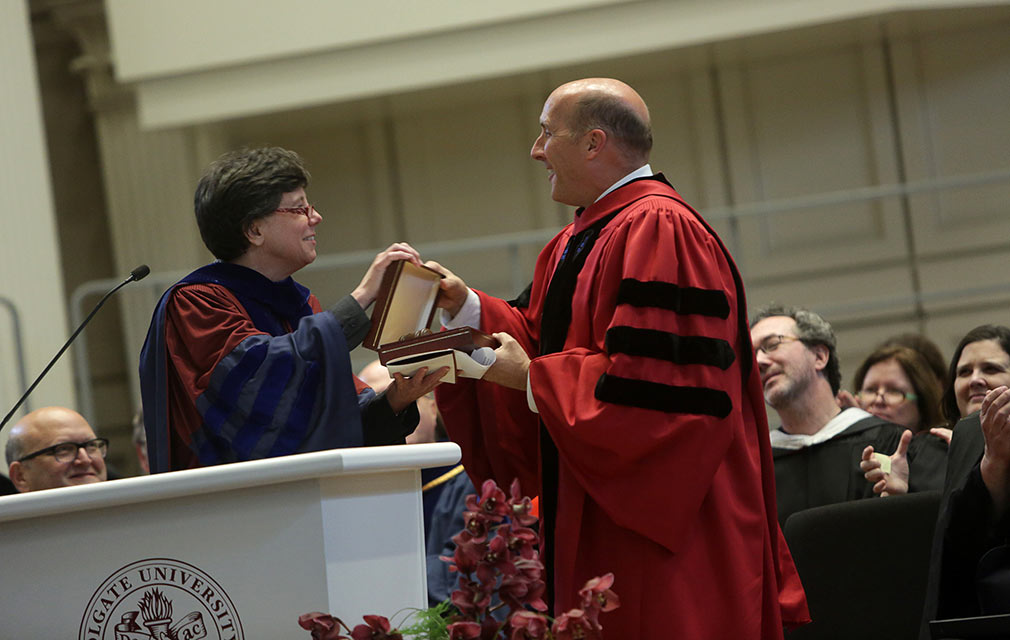 Connie Harsh, interim dean of the faculty, presents President Casey the faculty gavel — and with it, "the authority to help shape debate and conversation."