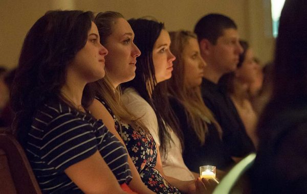 The campus community gathered in the chapel on Sept. 20, 2016, to honor the lives of Ryan Adams ’19 and Cathryn (Carey) Depuy ’19, who died on that date in a 2015 plane crash in Morrisville, N.Y. Konosioni invited people to the Quad before the vigil to write memories, wishes, or thoughts on colorful felt squares.