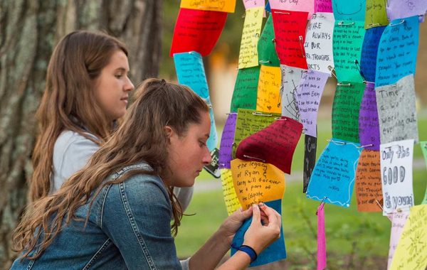 The campus community gathered in the chapel on Sept. 20, 2016, to honor the lives of Ryan Adams ’19 and Cathryn (Carey) Depuy ’19, who died on that date in a 2015 plane crash in Morrisville, N.Y. Konosioni invited people to the Quad before the vigil to write memories, wishes, or thoughts on colorful felt squares. 