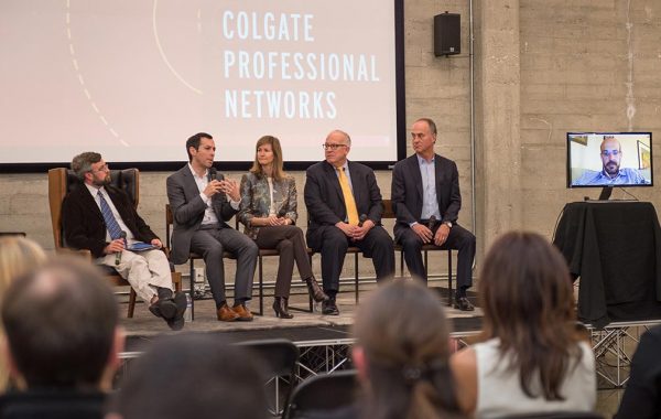 Panelists respond to questions on stage at a Professional Networks event.