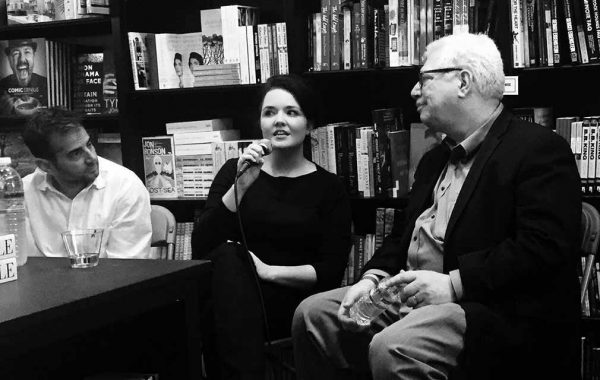 Mary Anna King '04 answers a question at a book reading, flanked by Chris Edwards '91 and Michael Hiltzik '73
