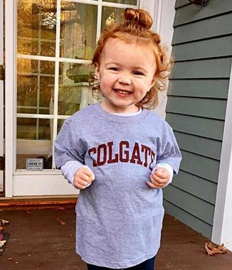 Two-year-old Madeleine Marsi, daughter of Stephen Marsi ’01 and granddaughter of Rick Marsi ’69, flashes her Colgate smile. 