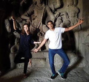 Two students pose for a photo at a site in India