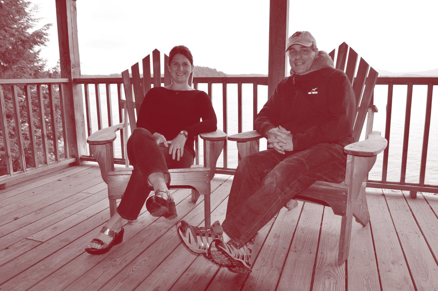 Sandy ’88 and Greg Drechsel ’88 in Adirondack chairs at Colgate Camp.