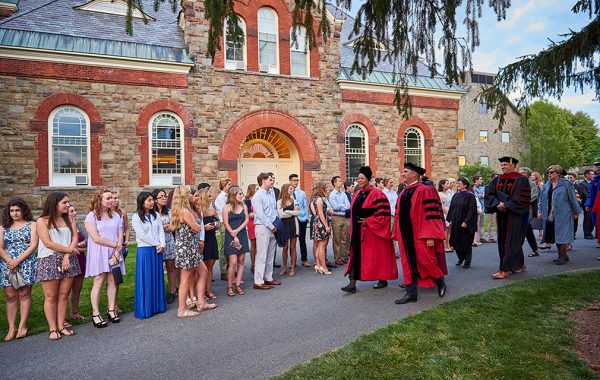 President Brian W. Casey and Provost Tracey Hucks '87, MA'90 lead a procession of faculty on the Academic Quad amidst first-year students before convocation