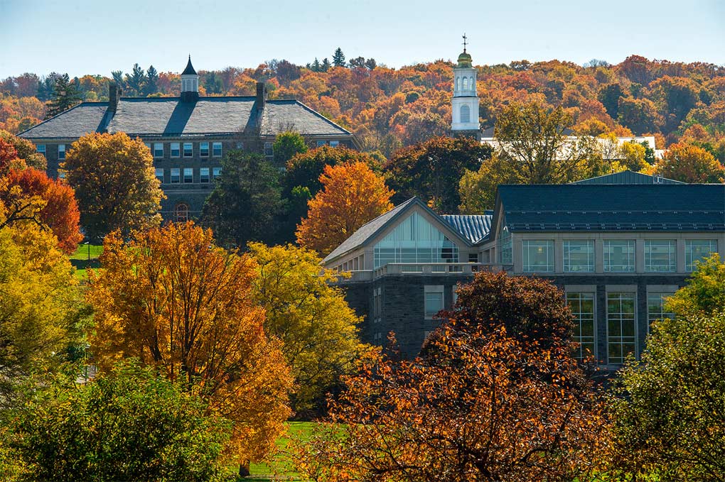 The Colgate University campus from a distance amidst autumn foliage