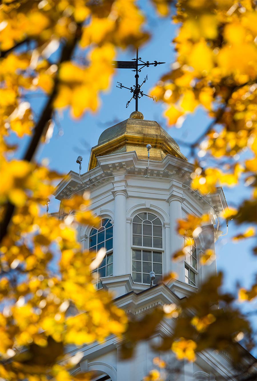 The Colgate Memorial Chapel cupola viewed through the fall foliage
