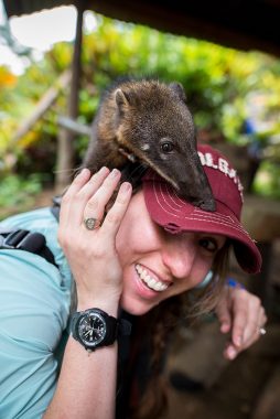 Danielle Cheifetz with furry creature on her Colgate cap in Peru