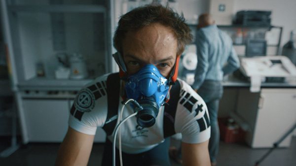close up of man wearing oxygen mask