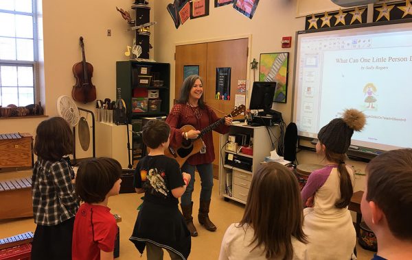 Suzanne Propp '85 with an elementary school music class