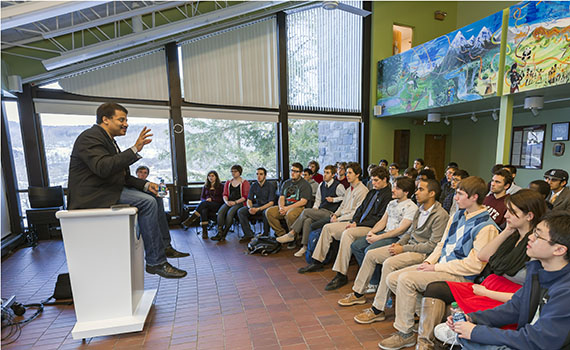 Neil deGrasse Tyson speaks with students at the ALANA Cultural Center as part of his visit to Colgate University.