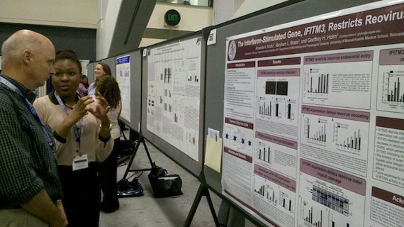 Colgate University student Amanda Anafu '14 explaining her research