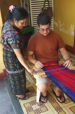 Viktor learning to weave on the backstrap loom 
