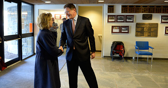Colgate President Jeffrey Herbst greets Hillary Rodham Clinton just before her address at Sanford Field House. (Photo by Andy Daddio)