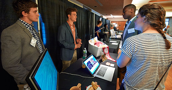 Students discuss their ventures during day two of Entpreneurship Weekend. (Photo by Andy Daddio)