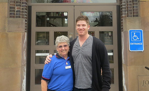 Longtime Frank Dining Hall cashier Jean Brooks and Christian Long '13, a former member of the hockey team