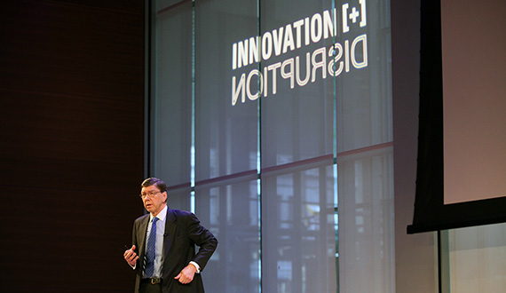 Clayton Christensen speaks Monday at the Innovation + Disruption symposium. (Photo by Lorenzo Ciniglio)