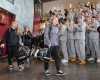 Students cheer on women's ice hockey players as they carry gear out of the Class of 1965 Arena