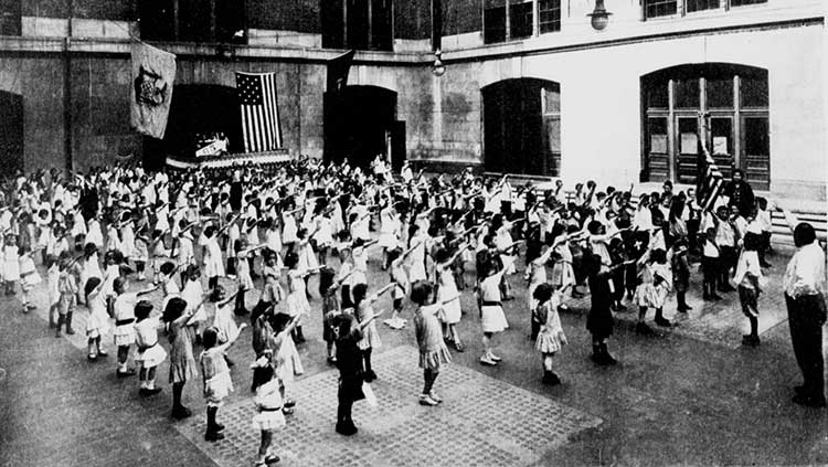 American children performing the original correct American flag salute in 1915 
