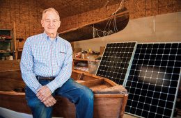 David Borton sitting with Solar panels