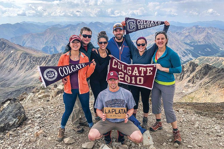Colgate group with pennants on mountain summit