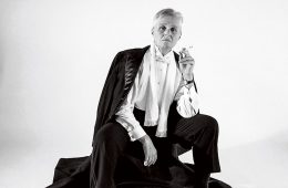Black and white portrait of Linn Underhill in tuxedo holding cigarette