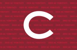 The Colgate C over a red and maroon pattern reading DEO AC VERITATI