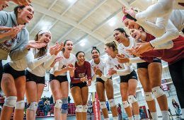Colgate volleyball team in a huddle