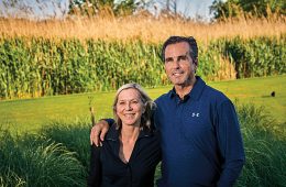 Lee and Bob Woodruff standing in front of cornfield