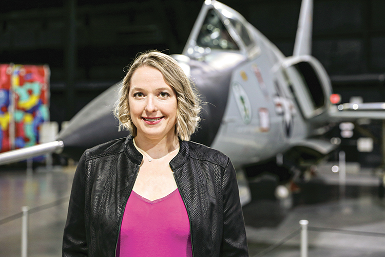 Anne Cybenko in front of a military jet