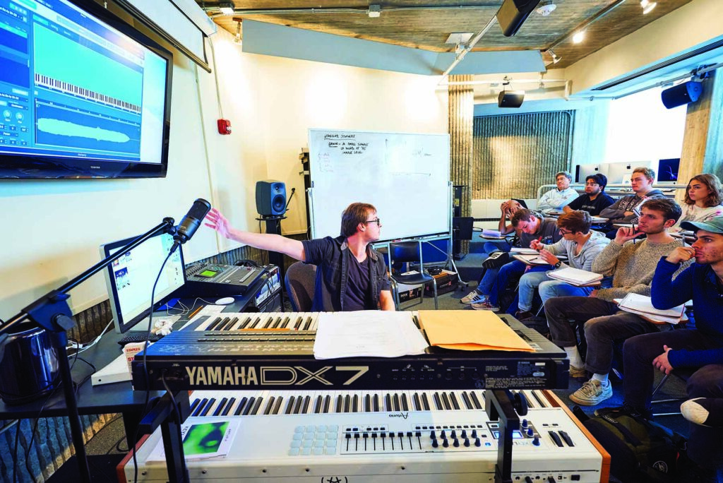 Ryan Chase, assistant professor of music, teaches a class in digital music production in the digital music studio in Dana. Photo by Andrew Daddio