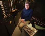 Doug Erwin posing with Smithsonian Museum specimen