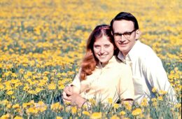Pam and Tom in a dandelion field