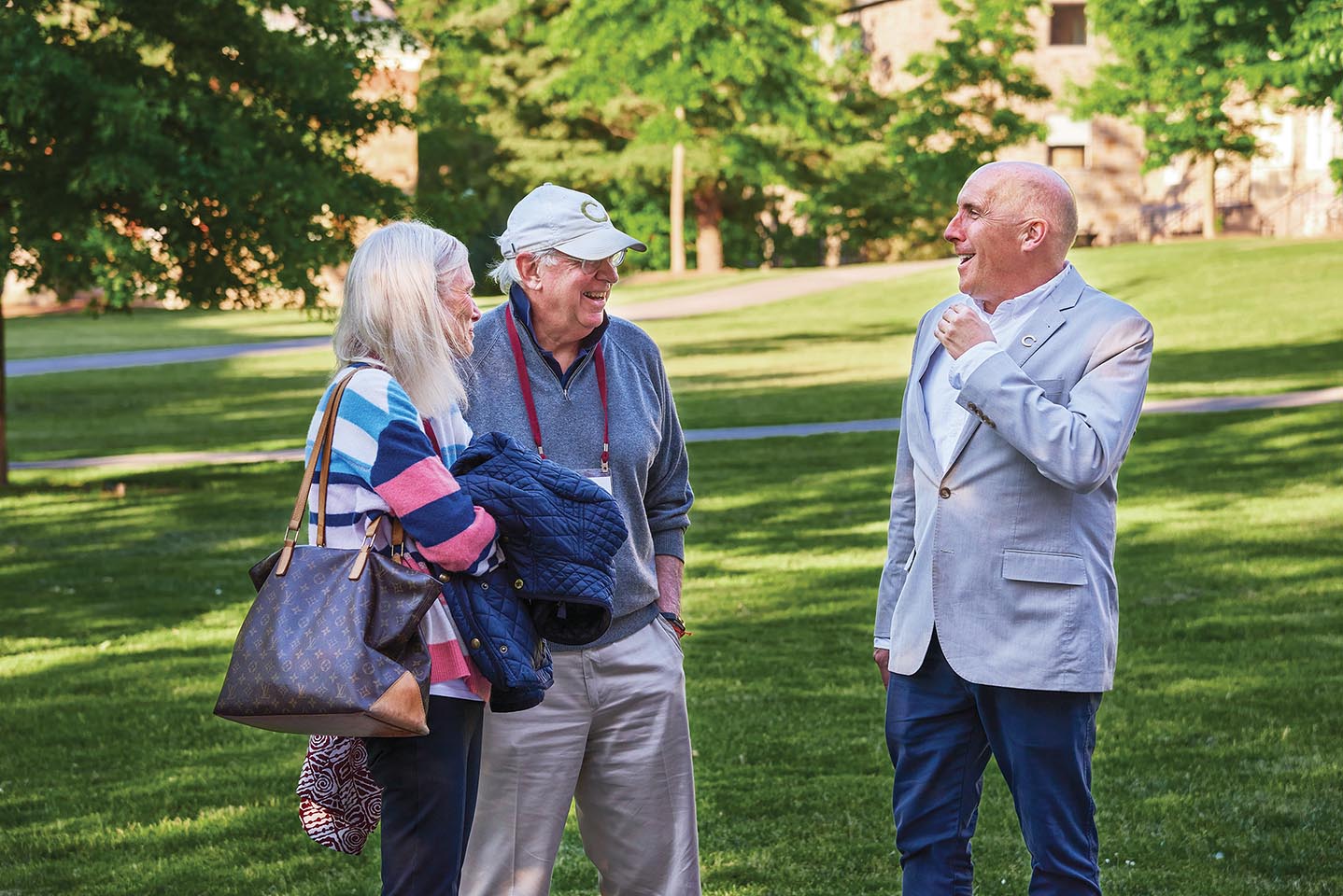 President Casey speaks with two alumni during Reunion Weekend