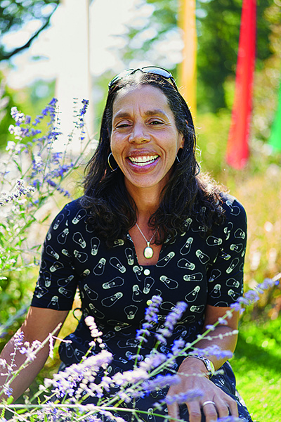 Portrait of Jeanine Canty ’92 in a flower meadow