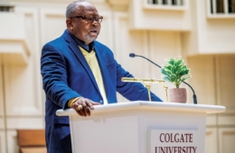 Edwin Bass '71 stands behind the podium in Memorial Chapel as he gives the keynote speech during the 2023 MLK Week Celebration.